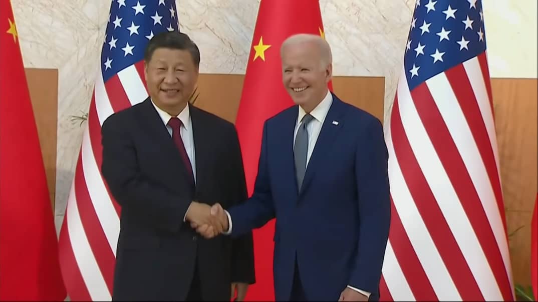 joe biden shakes handss xi jinping in bali